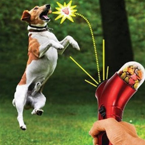 “Pet treat catapult feeder – handheld dog and cat treat launcher with wrist strap and spring trigger”