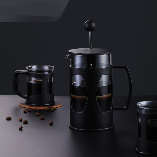 Manual coffee press French press brewer on a kitchen counter

Close-up of plunger and fine metal mesh filter in coffee press

French press pouring freshly brewed coffee into a mug

Disassembled coffee press showing carafe, lid, and filter